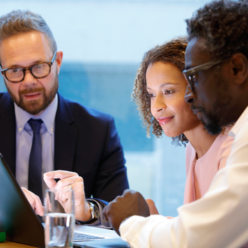 Financial advisor having a meeting with clients - stock photo