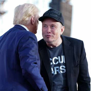 Elon Musk speaks with former president Donald Trump during a campaign event at the Butler Farm Show, Saturday, Oct. 5, 2024, in Butler, Pa.