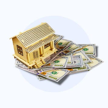 Image of a house sitting atop money
