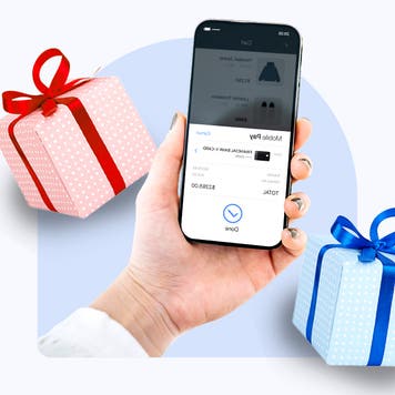 Design element consisting of a cell phone and holiday gifts in the background