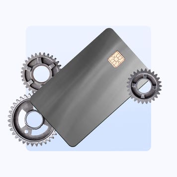 Photo illustration showing a credit card with spinning gears