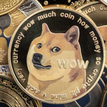 Illustration of several crypto tokens with a Dogecoin token occupying a prominent place.
