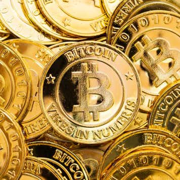 Artistic rendering of golden Bitcoin tokens.