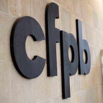 A picture of the side of the Consumer Financial Protection Building, showing the CFPB logo
