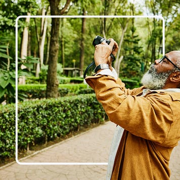 Person holding up a camera.