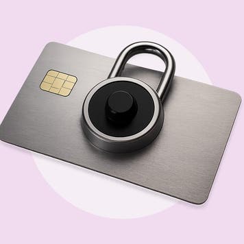 A grey credit card with a dial lock on it.