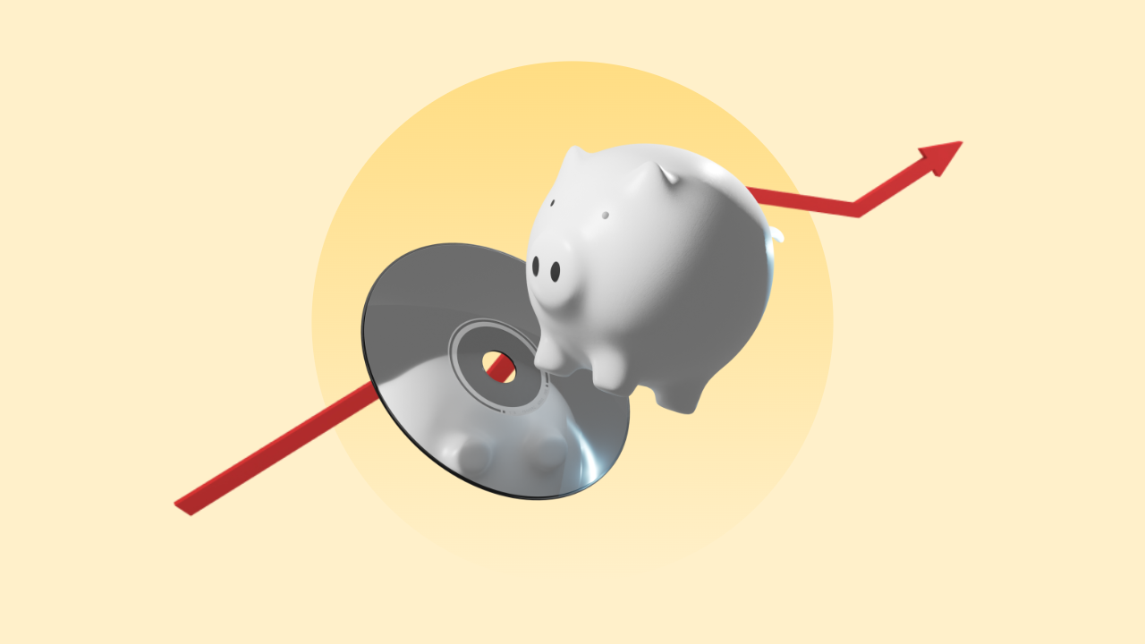 A music CD underneath a piggy bank