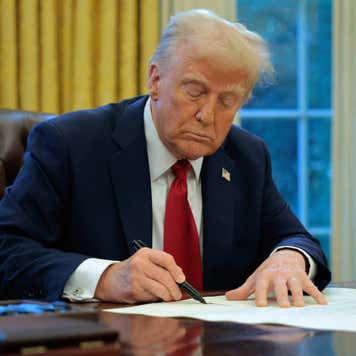 President Donald Trump signs an executive order.