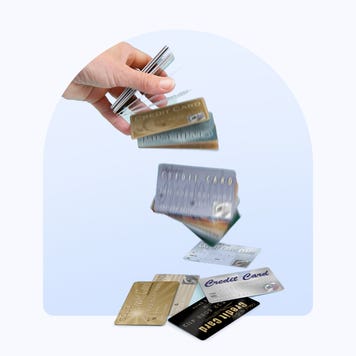 Design element with credit cards falling from a hand.