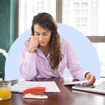Design element of a person sitting at desk with a laptop.