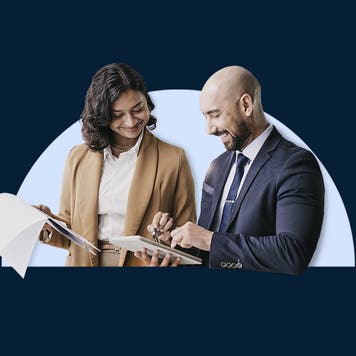 design element with 2 people looking over documents