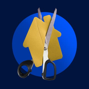 design element of a house cutout being cut by scissors