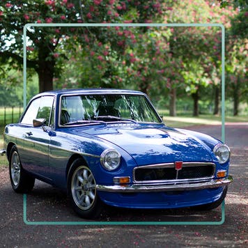 Blue car on rural driveway