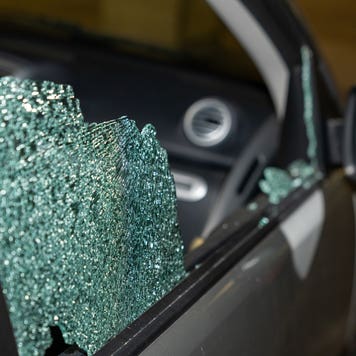closeup of front window of vehicle shattered