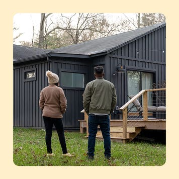 design image of a couple standing in front of their home