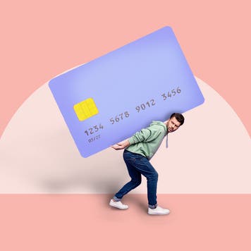 Man being weighed down with a credit card on his back.