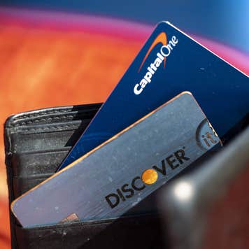 Capital One and Discover cards in a wallet.