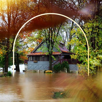 Design element with a photo of a home that has been flooded.