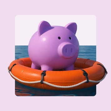 Image of a round pink piggybank in a life raft floating on water.