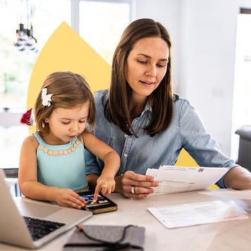 design image of a woman and her daughter at a table, woman reading bills