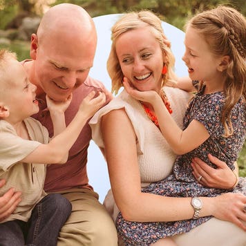The Bly family sitting in a green area with an illustrated circle background.