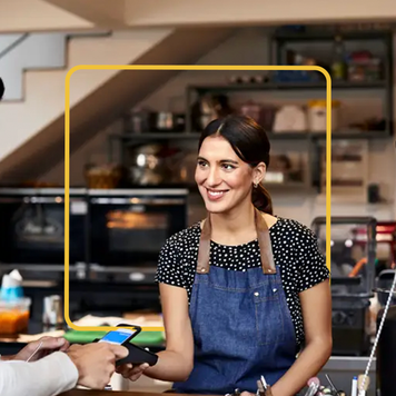 Woman and man in a shop doing business