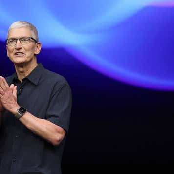 Apple CEO Tim Cook presenting on a stage.