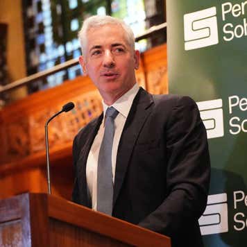 Bill Ackman speaking from behind a podium.