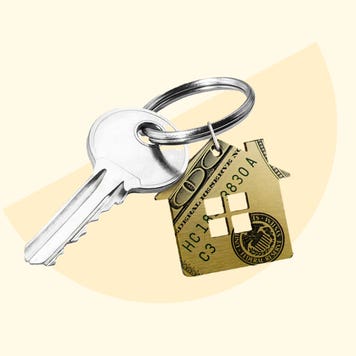 An image of a key that has a key chain of a stylized house made out of money.