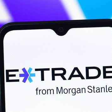 E-Trade logo displayed on a samrtphone.