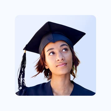 A headshot of a graduating student thinking about something