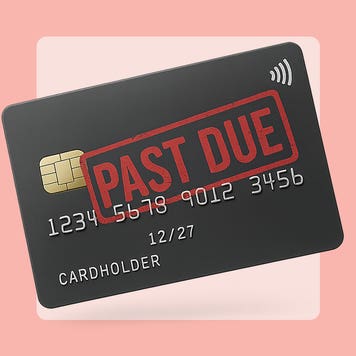 A credit card with a "past due" stamp on the front