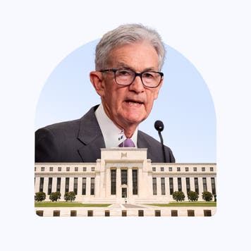 Image of Jerome Powell above the Federal Reserve Building.