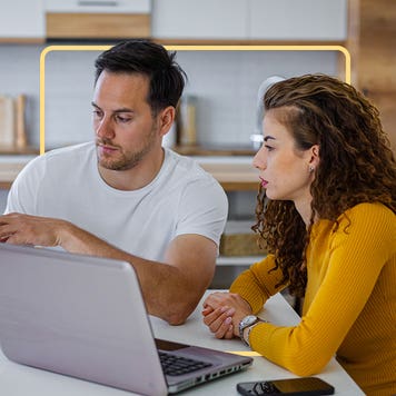 a couple looking at a documents