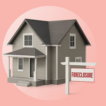 House with sign in the front.