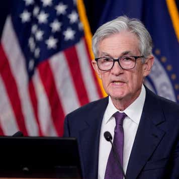 Federal Reserve Chair Jerome Powell speaking behind a podium.