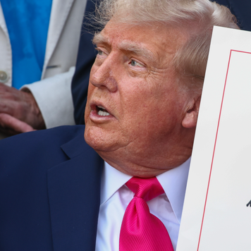 President Donald Trump, joined by Republican lawmakers, signs the One, Big Beautiful Bill Act into law during an Independence Day military family picnic on the South Lawn of the White House on July 04, 2025 in Washington, DC.