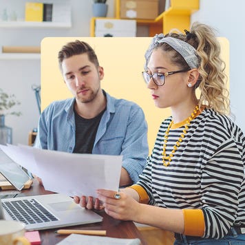 Man and woman creating business plan