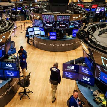 Traders work on the floor of the New York Stock Exchange (NYSE) in New York, US, on Friday, Aug. 15, 2025.