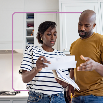 couple looking at loan notice