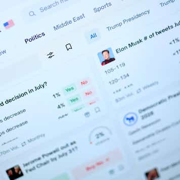 The Polymarket website on a laptop.