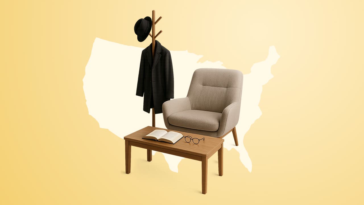 Image of a coat rack, with coat and hat hangin on it, standing next to a living room chair that sits behind a small coffee table that has an open book and glasses resting on it. This is superimposed on an outline of a map of the United States of America.