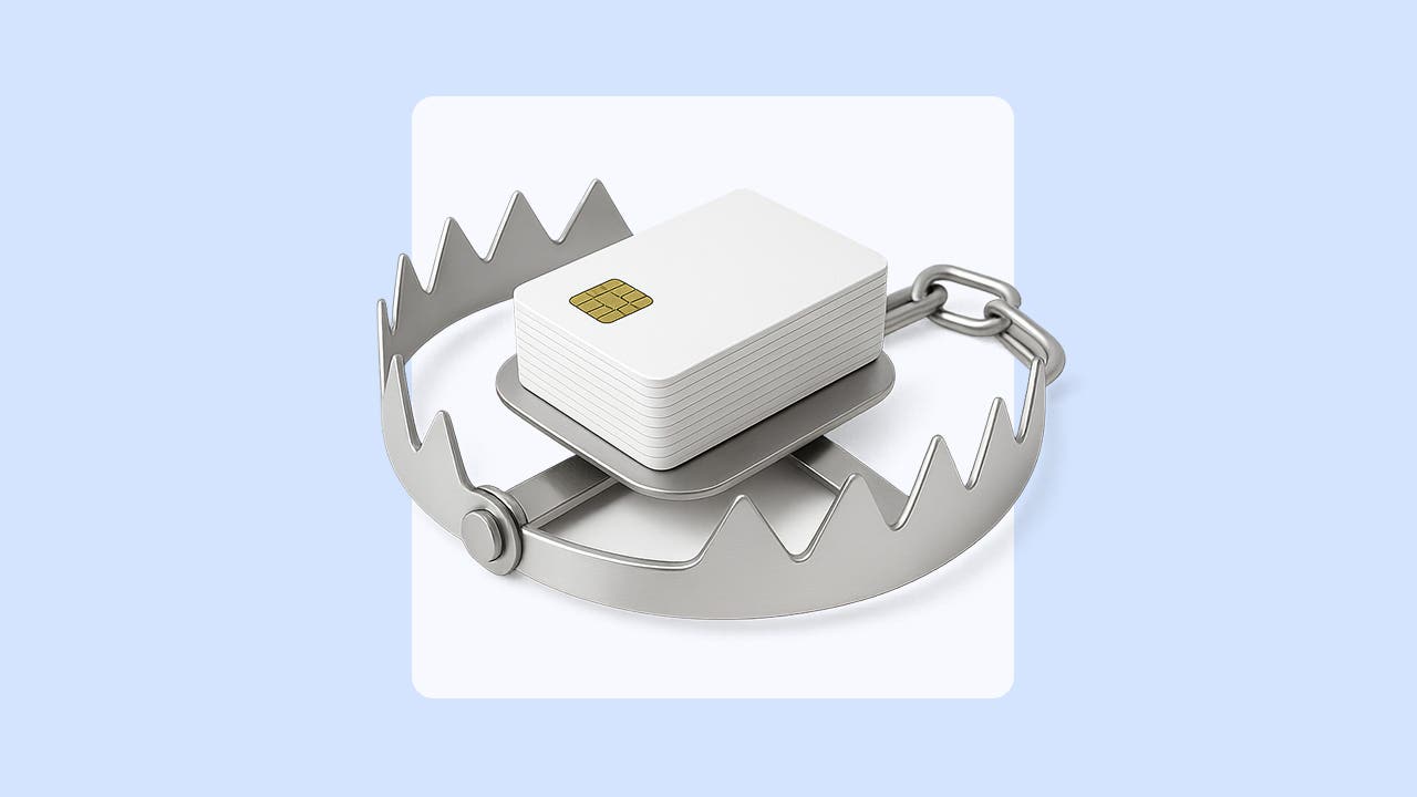 A graphic depiction of credit cards centered in a metal trap