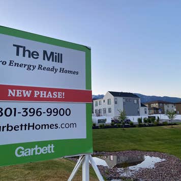 A sign advertising a new housing developement