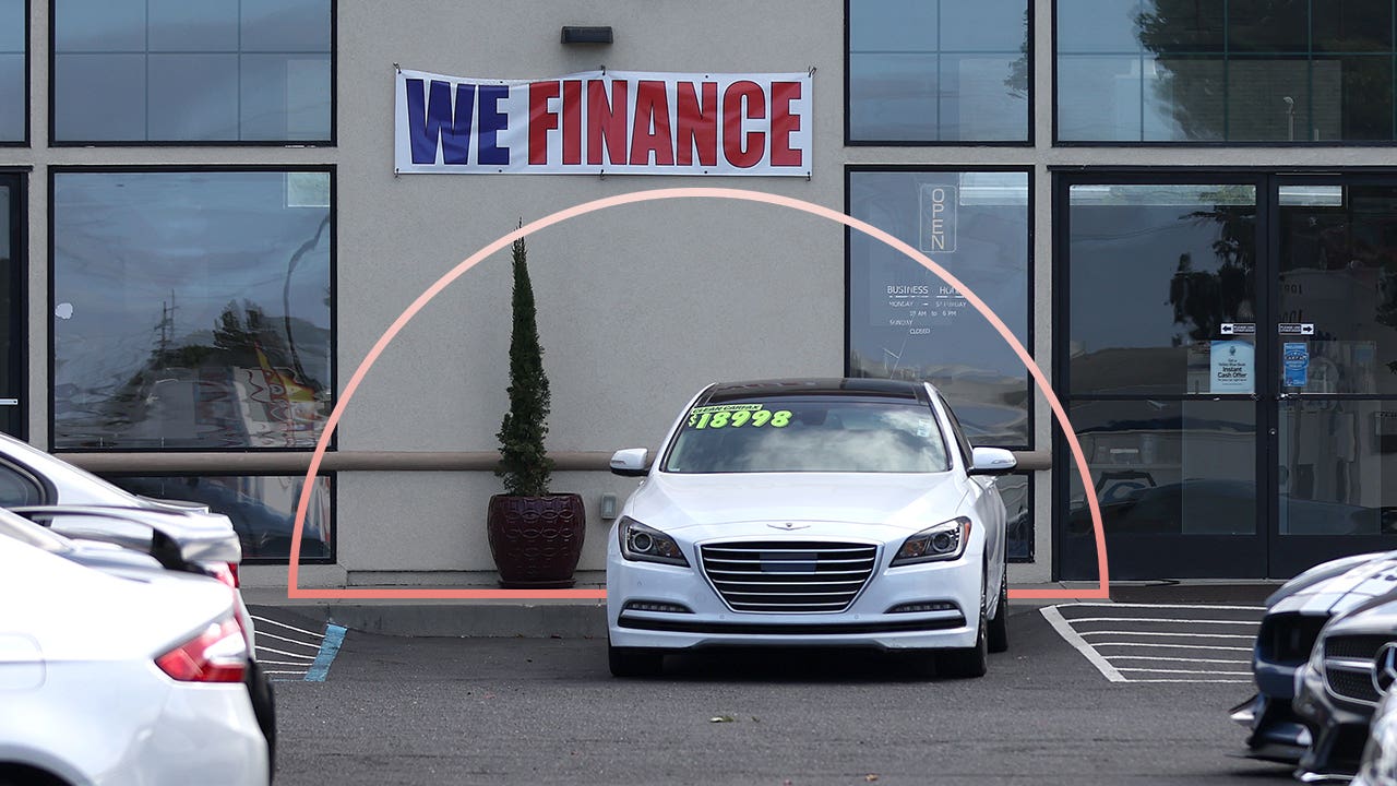 A dealership with a "We Finance" banner