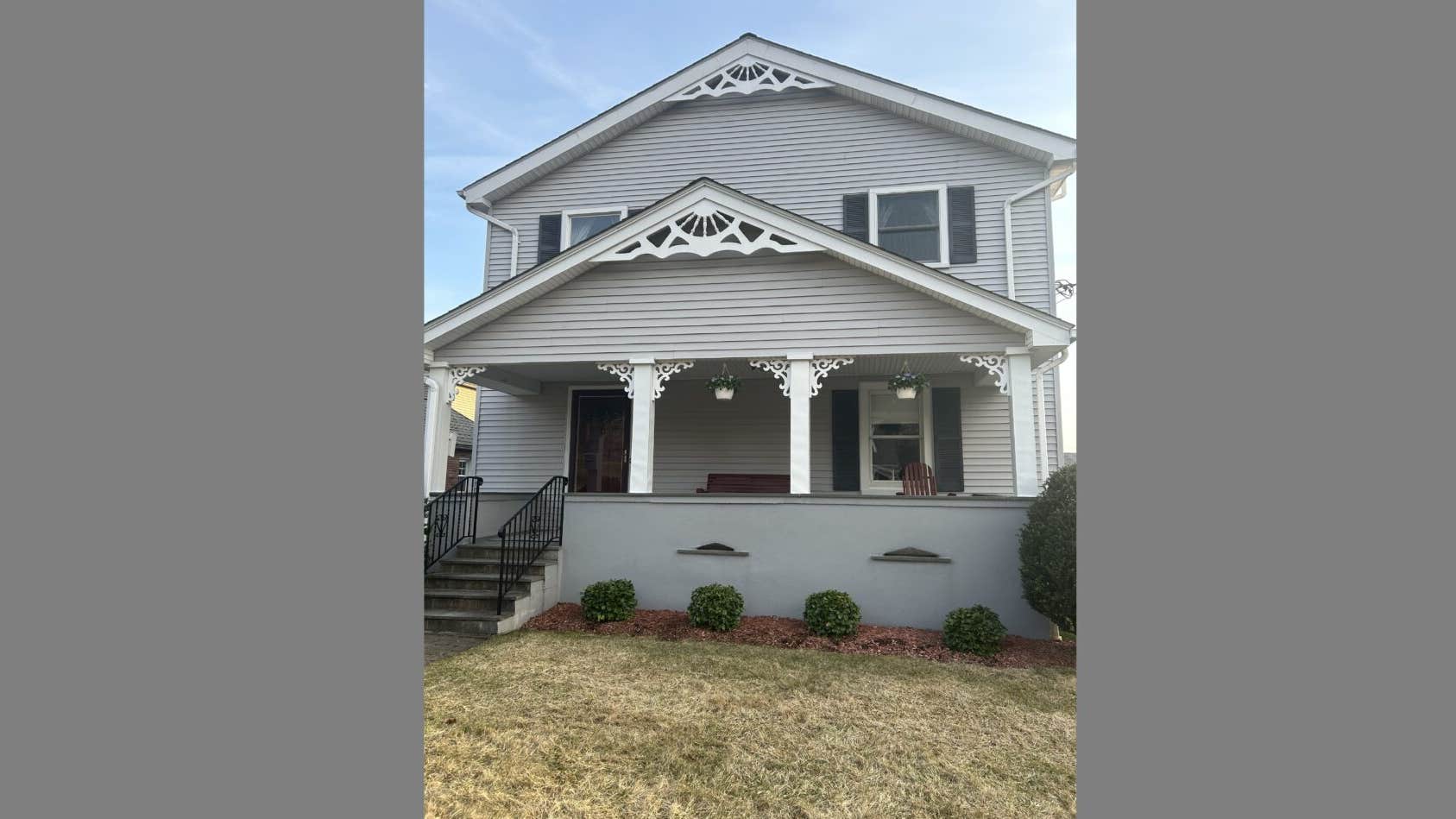 Image of a gray two-story home