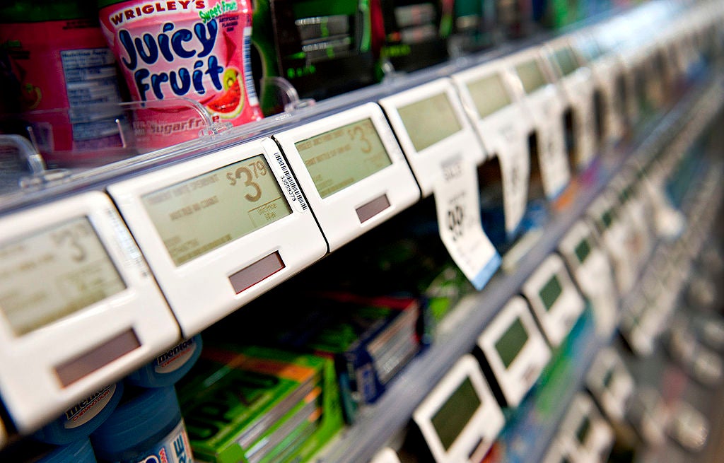 Digital price tags sit below candy items displayed for sale at a Walgreen Co. store in Oak Park, Illinois, U.S.