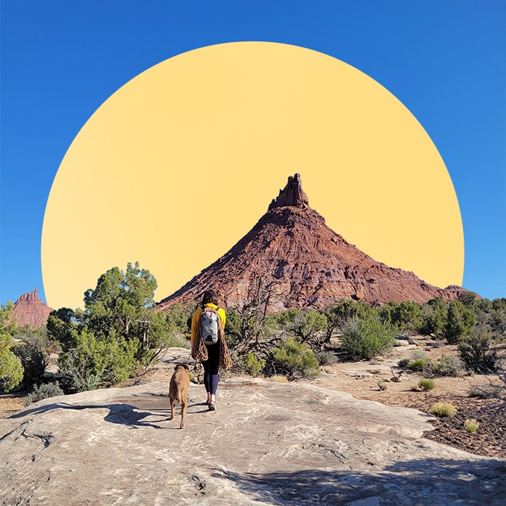 Ryan Katherine hiking with her dog in the desert.
