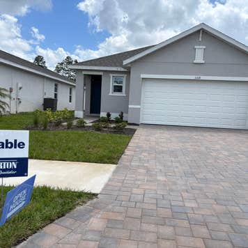 A home in Ft. Meyers, FL with a for sale sign out front