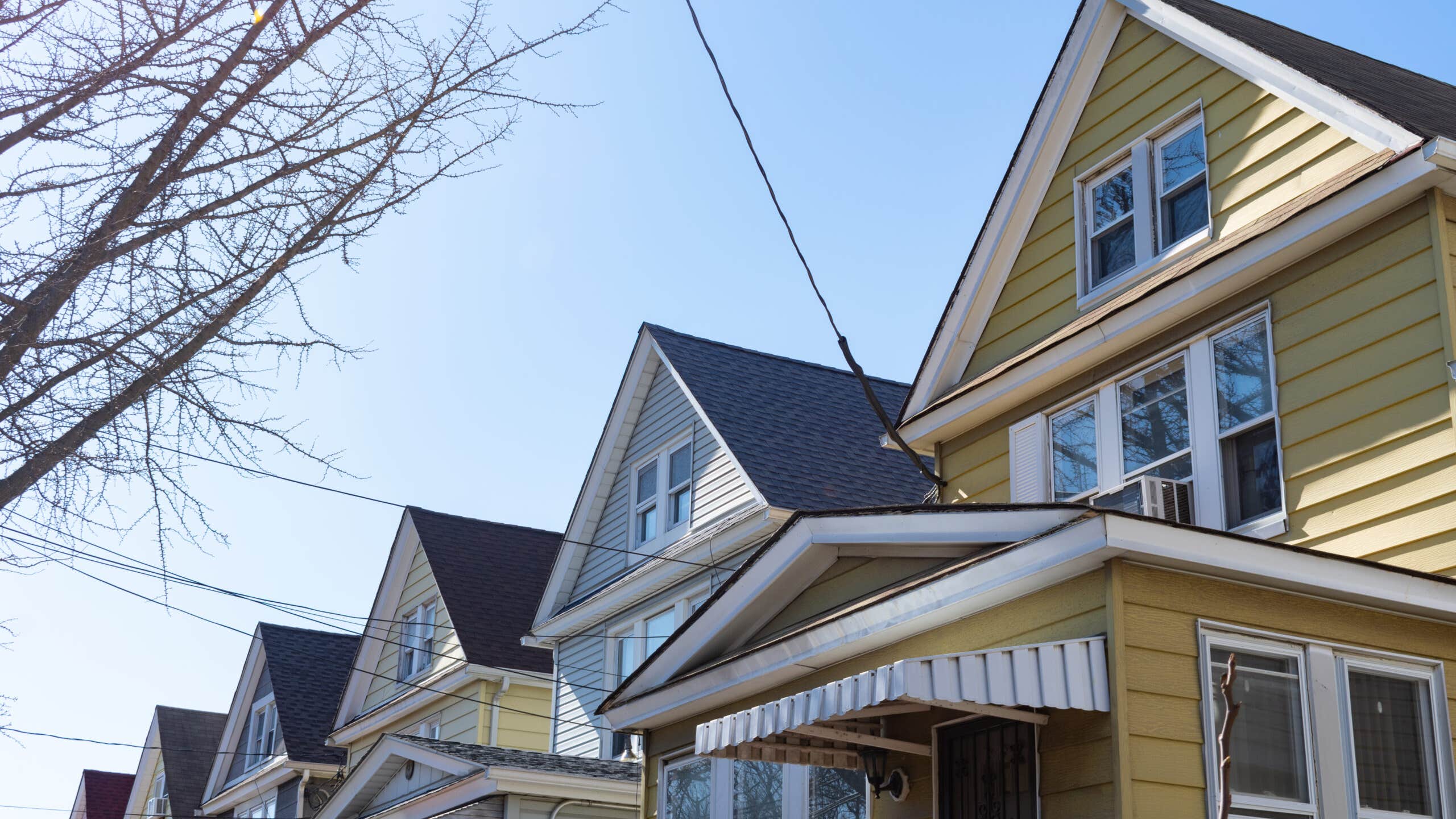 View of the tops of gabled homes in a row